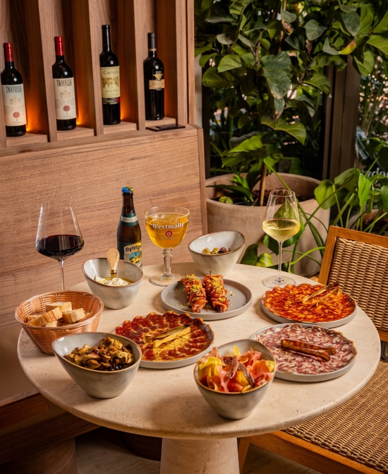 Table with various dishes and drinks in a restaurant setting
