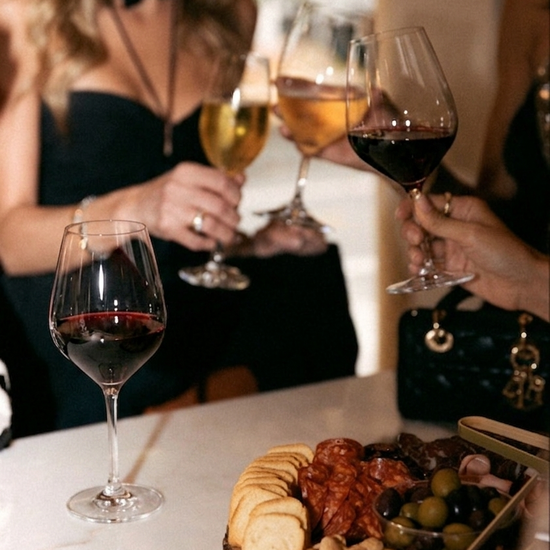 People enjoying wine and snacks at a social gathering